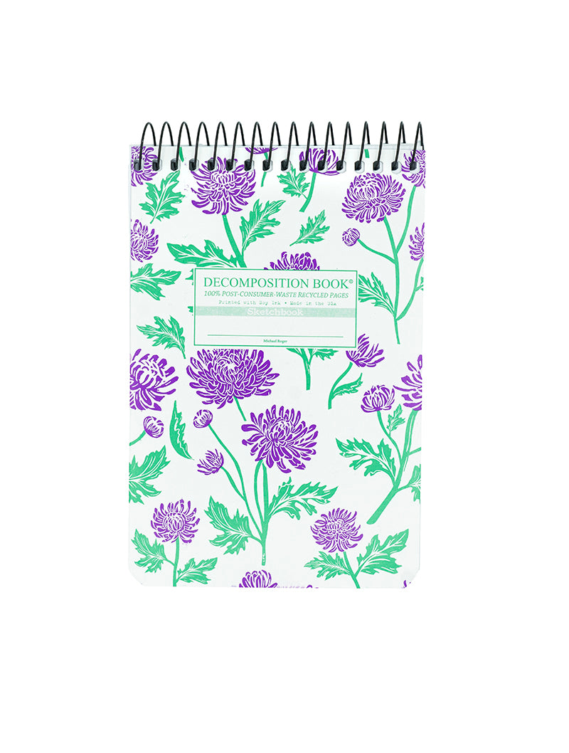 Notebook with floral design on a white background