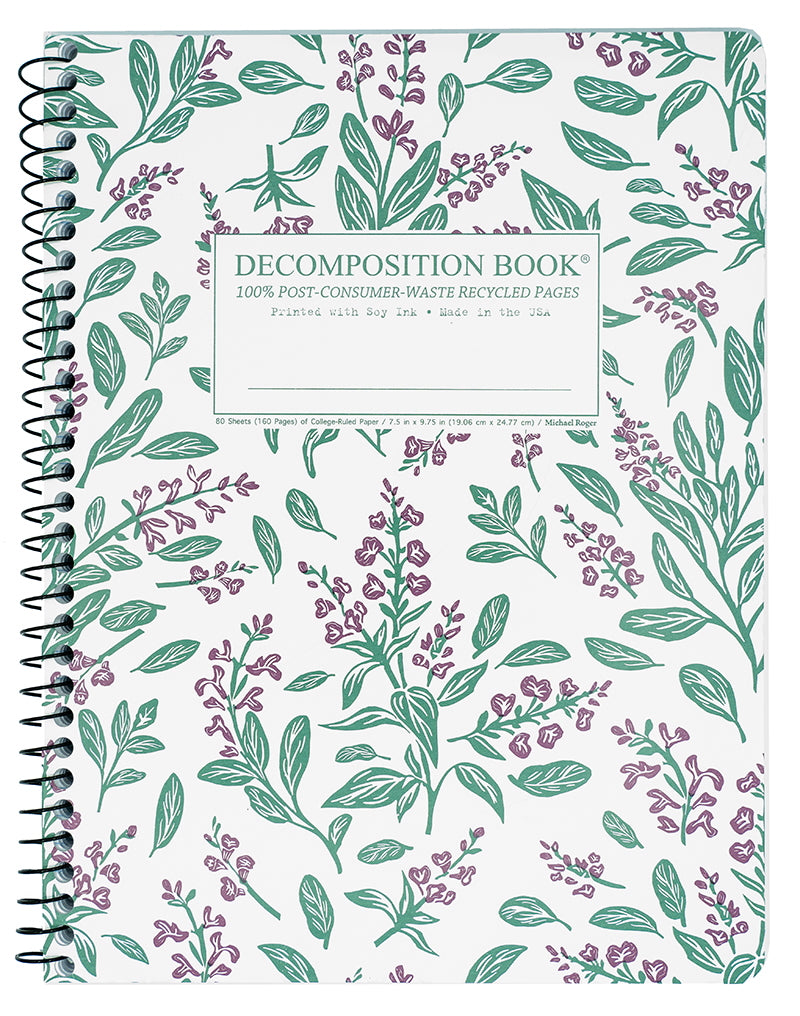 Notebook with floral pattern and 'Decomposition Book' label on a white background
