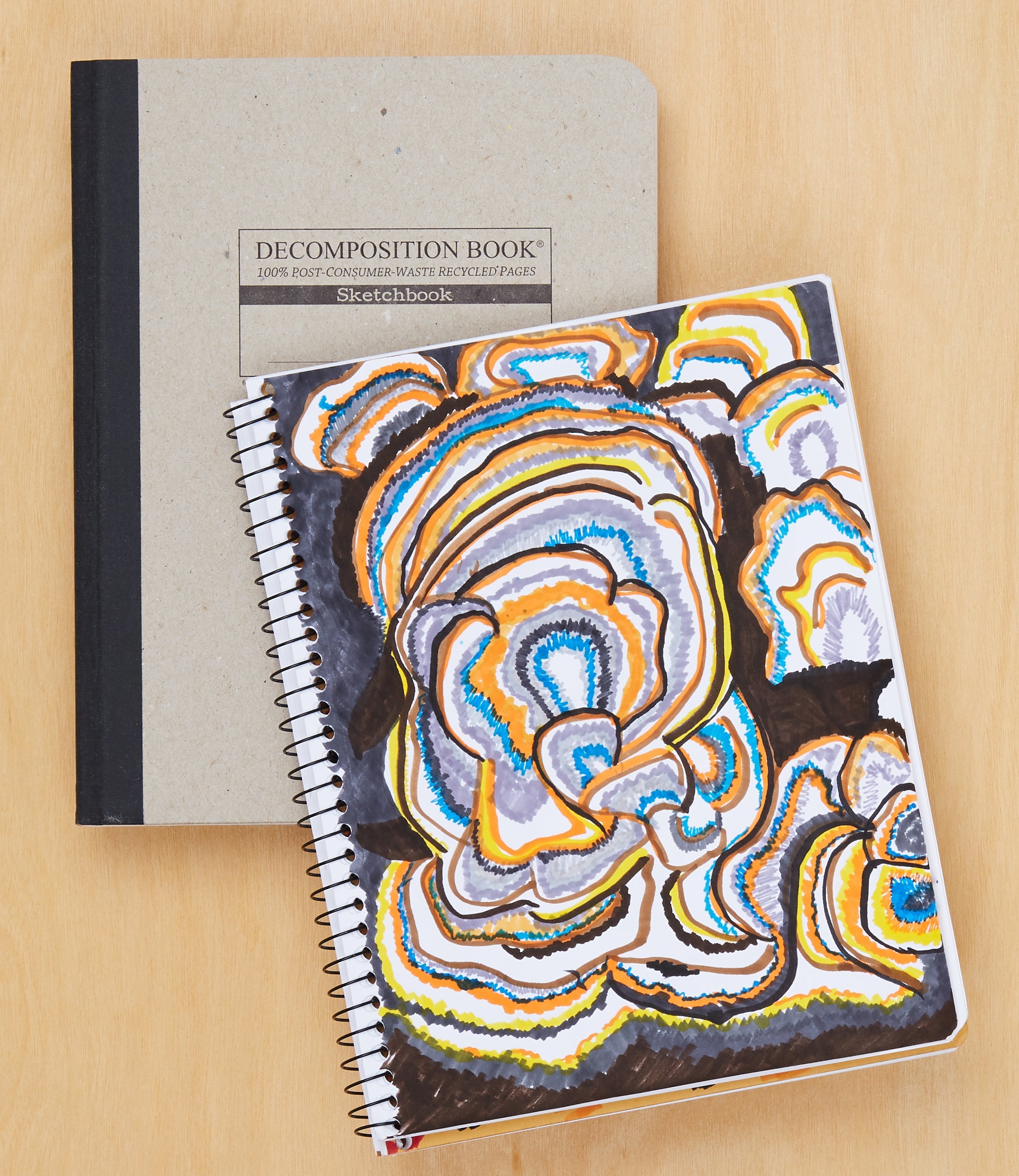 Swirling fungus drawing inside a sketchbook