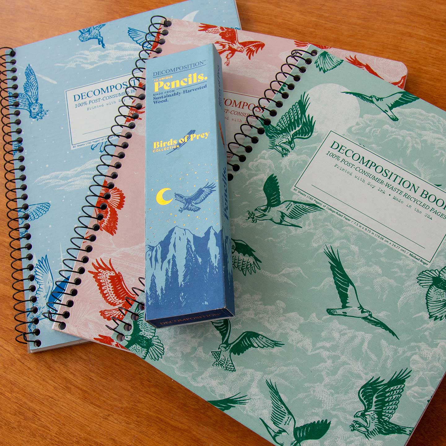 3 notebooks with birds of prey images and a pack of pencils