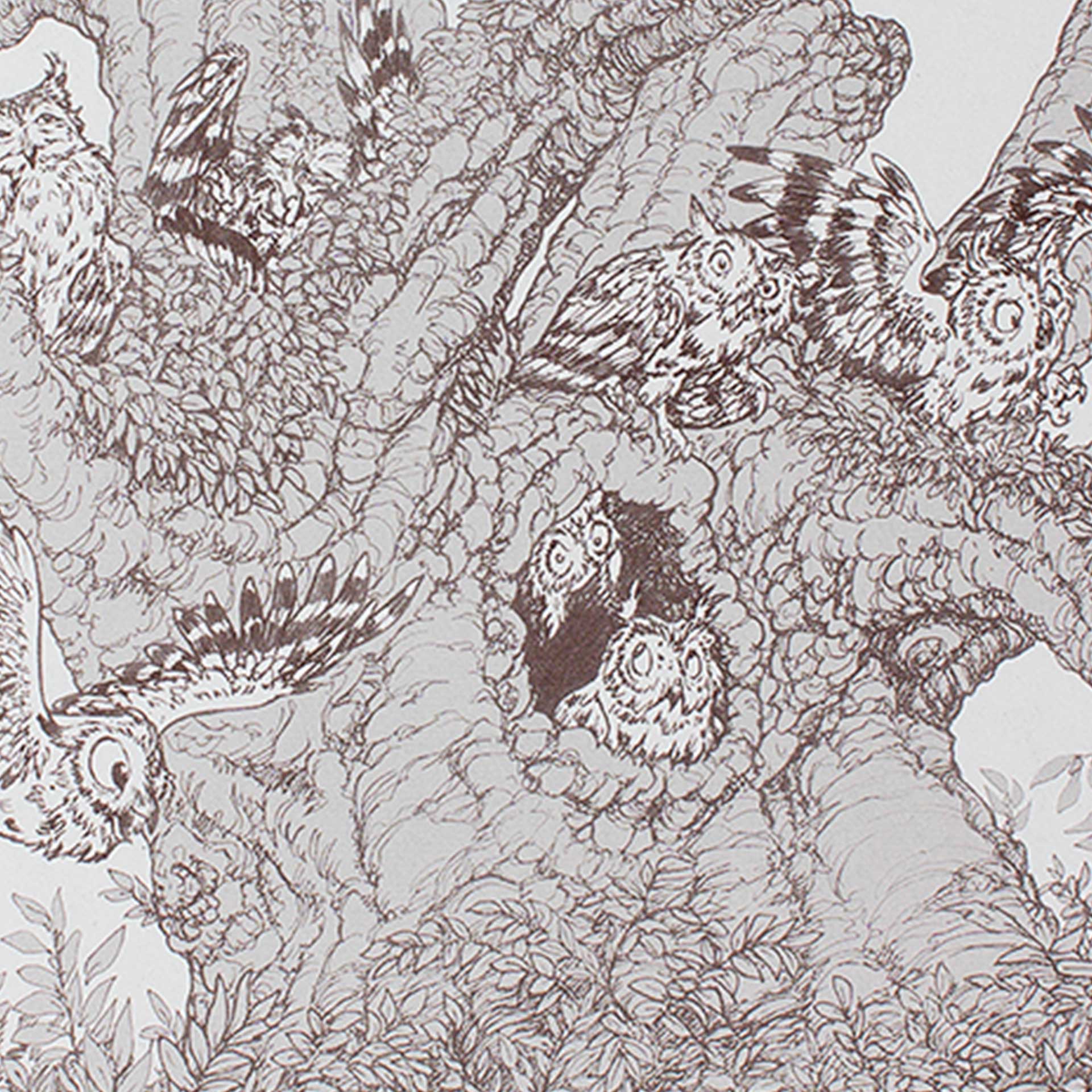 Closeup of printed owls in a large tree